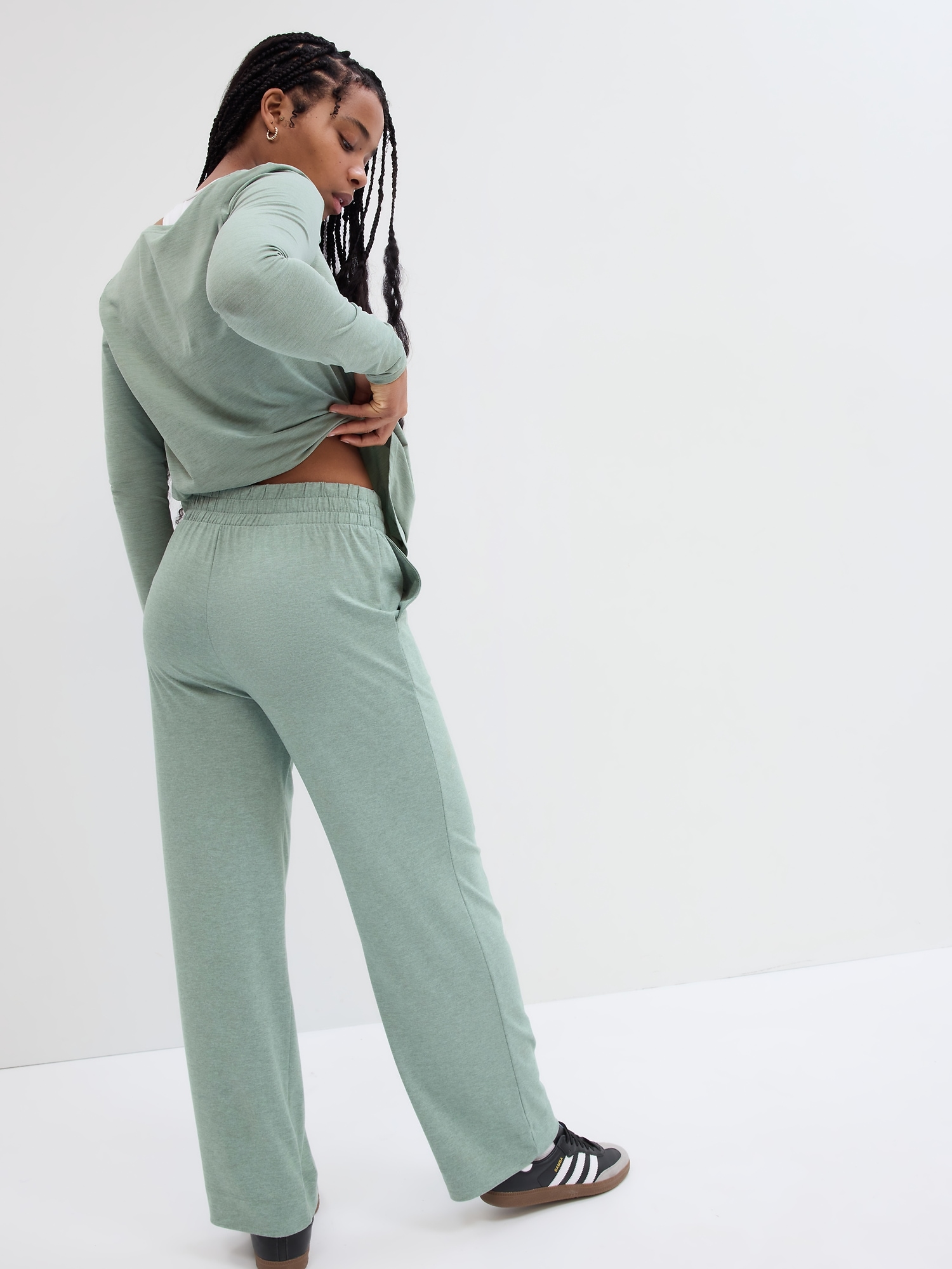 Buy Pants Rotate foil jersey straight-leg trousers (‭100143100‬) | Luxury  online store First Boutique
